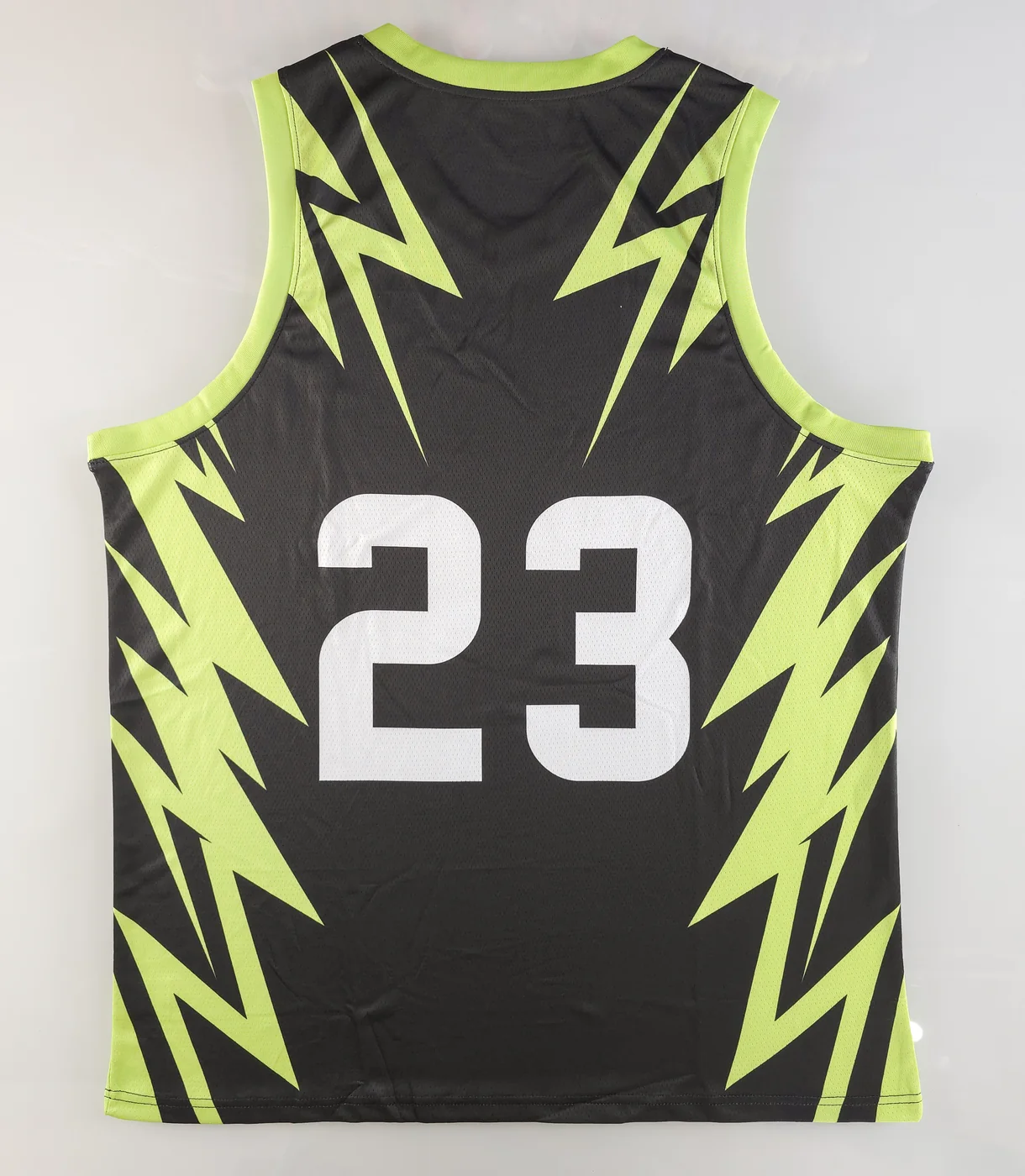 Back of black POXIOL basketball jersey showing number 23